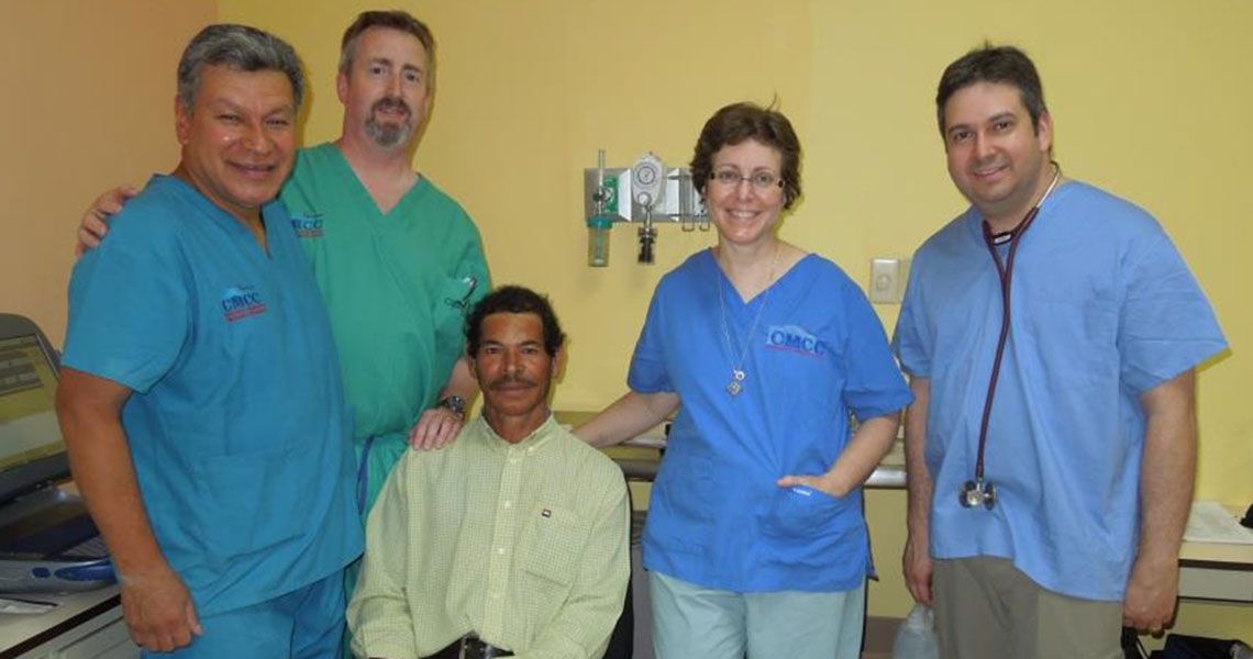 HVI providers standing with a Honduran patient